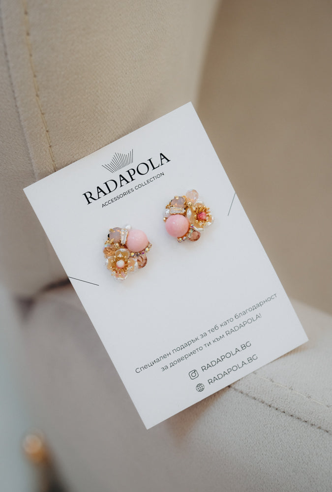 Delicate earrings with floral elements in pink