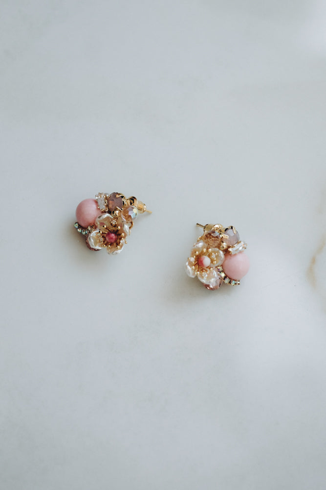 Delicate earrings with floral elements in pink