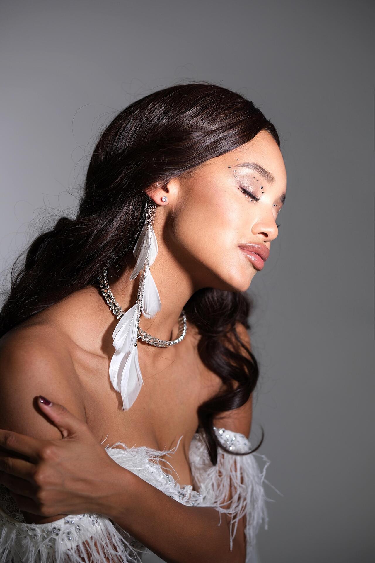 White feather ear accessory: Whisper Wing