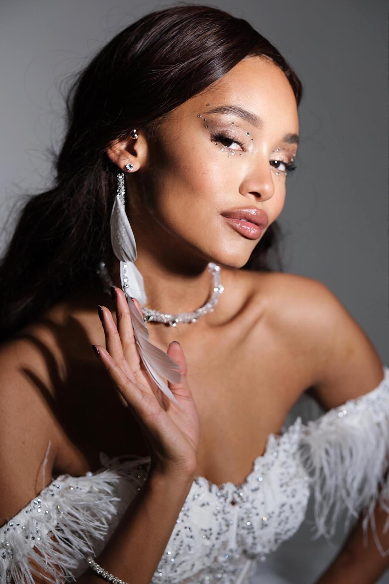 White feather ear accessory: Whisper Wing