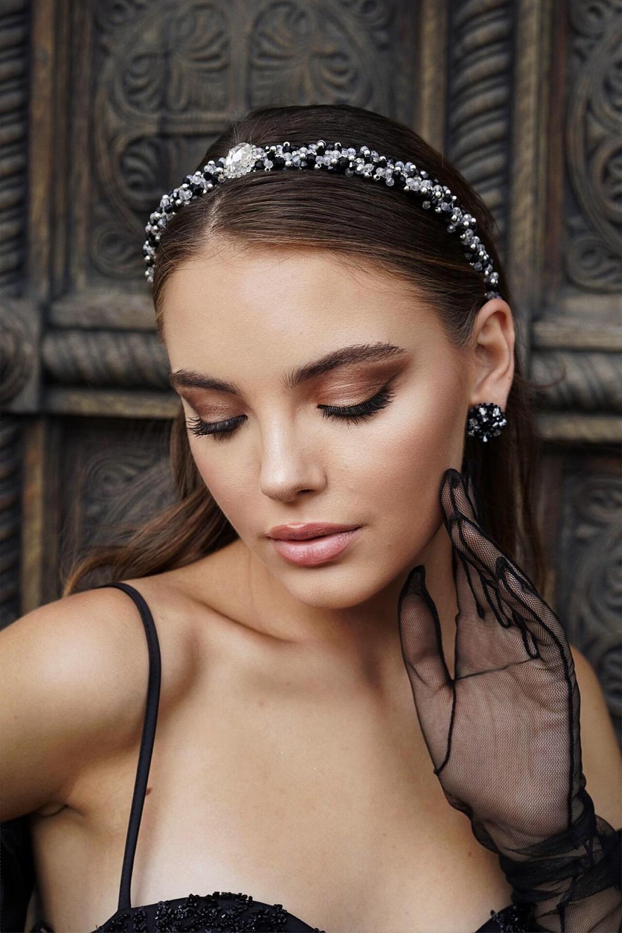 Hand-stitched earrings with crystals