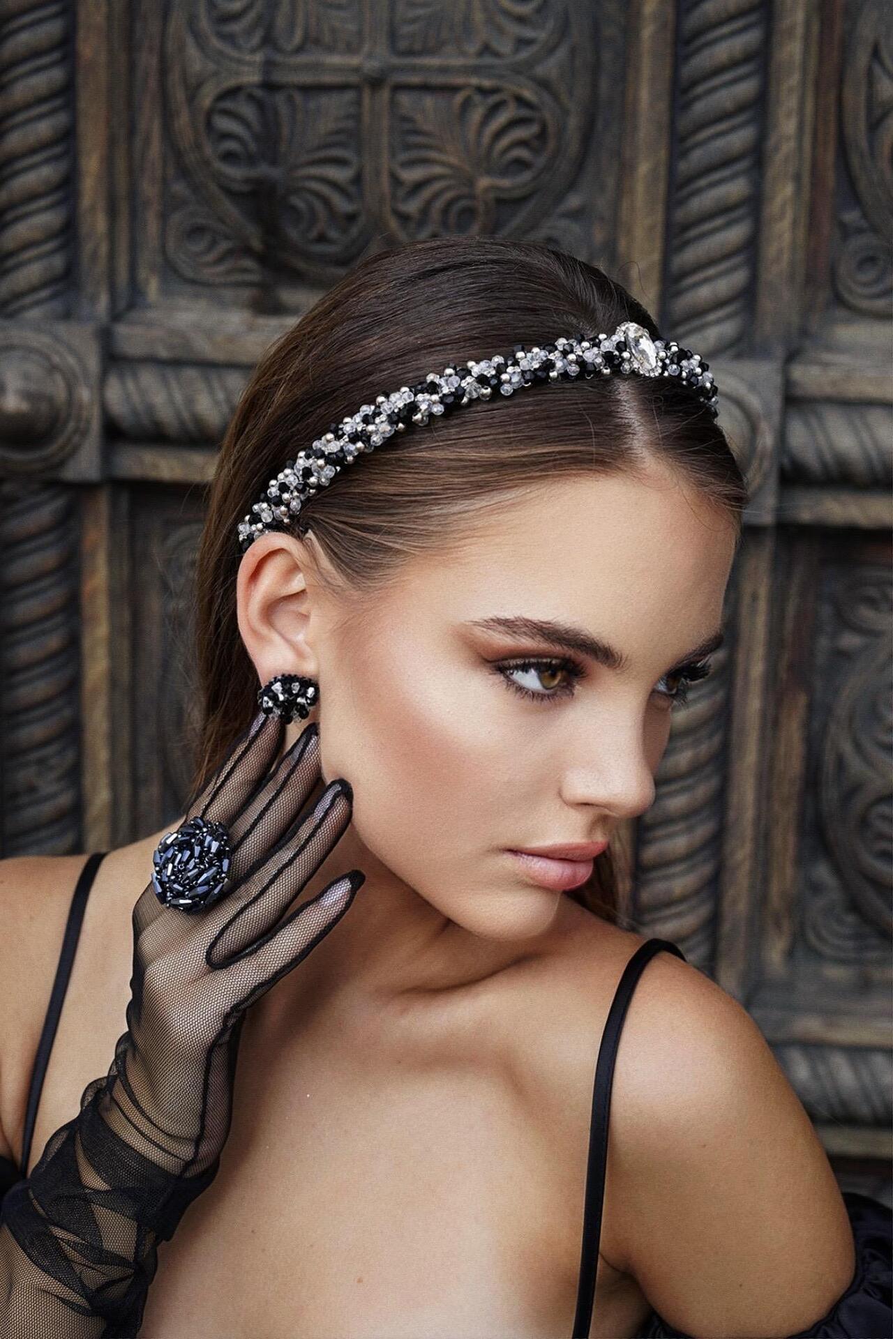 Hand-stitched earrings with crystals