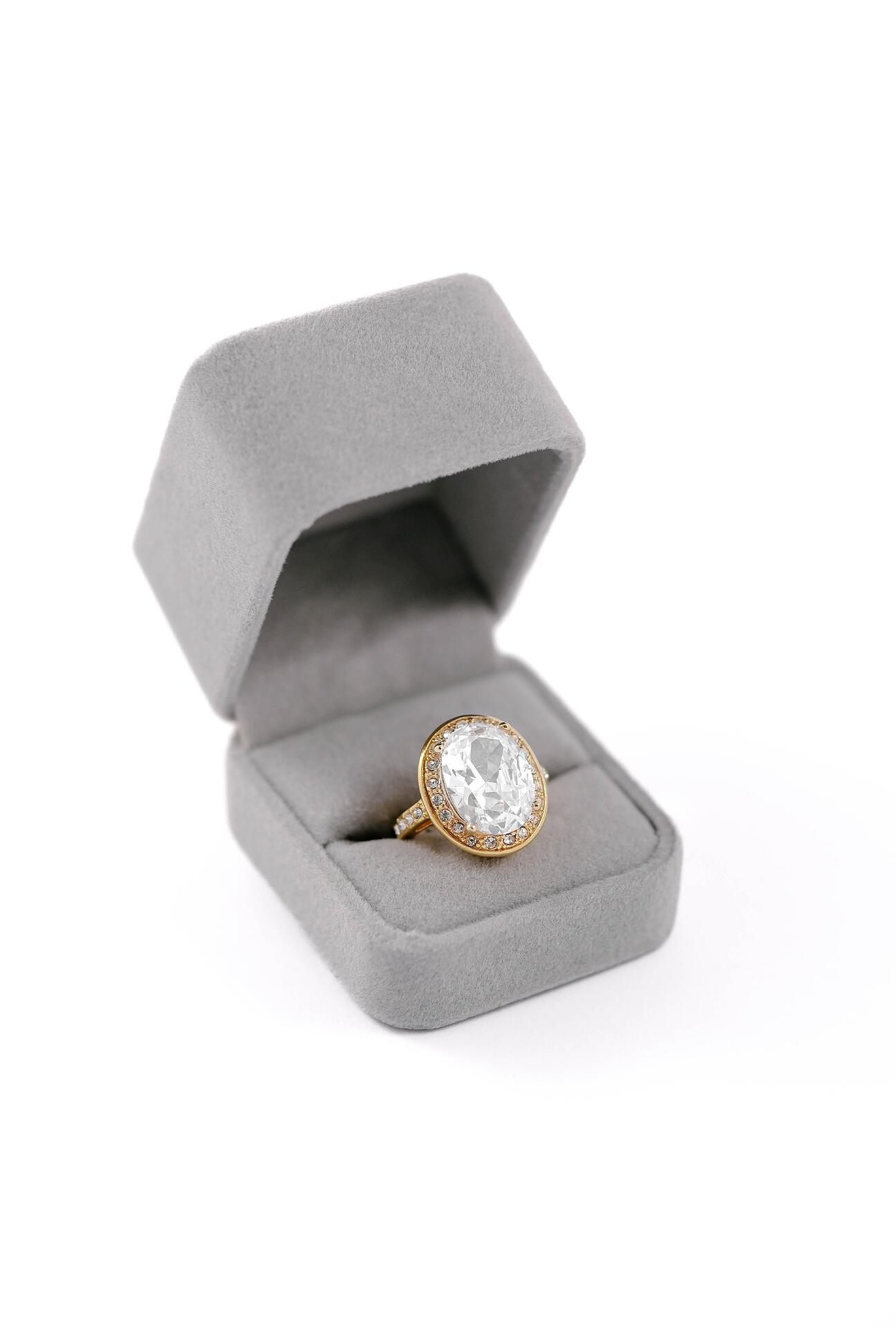 Gold ring with a massive elliptical stone