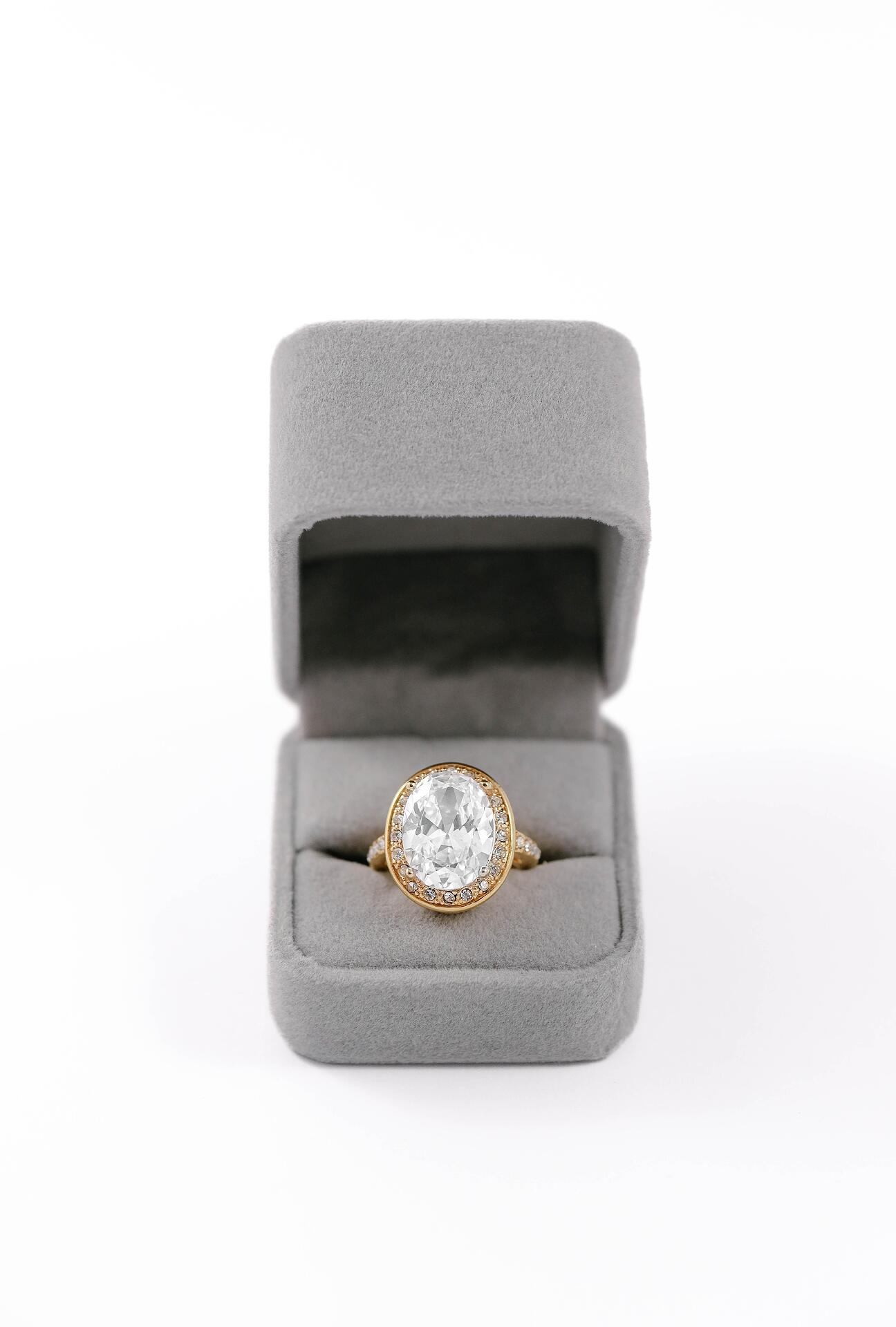 Gold ring with a massive elliptical stone