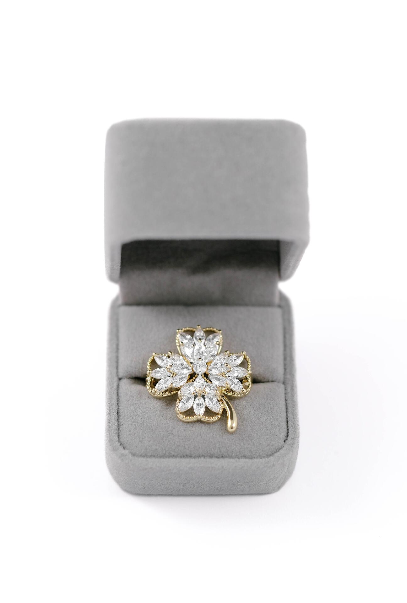 Golden clover brooch