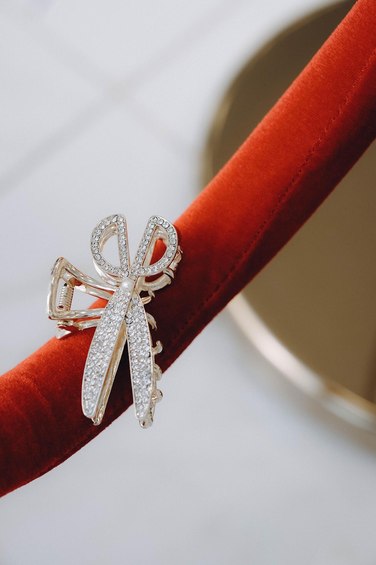 Golden scissors-shaped hair clip